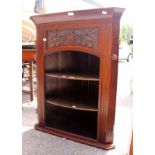 A late Victorian carved wall hanging corner open bookcase,