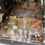 A collection of glassware, including salad bowls, Murano type vases, ship in a bottle,
