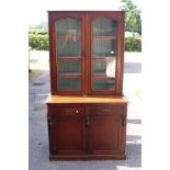 A Large Victorian Mahogany cupboard bookcase, two bottom doors with guard unit above. C.