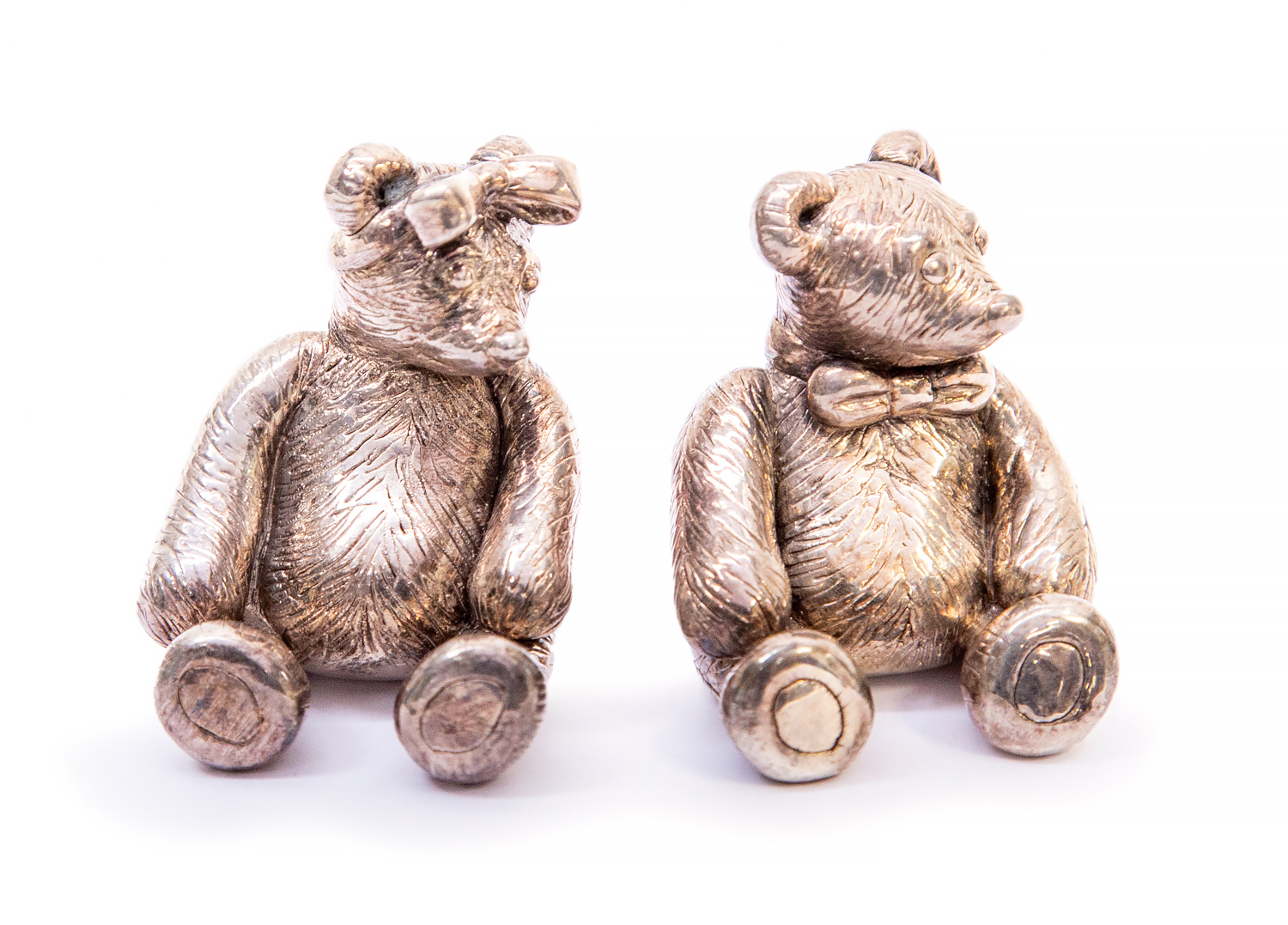 A pair of filled silver bears