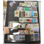 Blue card loose leaf album with mint and used stamps, blacks and stamps,