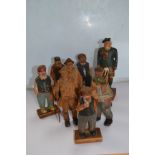 An interesting collection of six Canadian and three Black Forest carved figures (9)