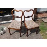 Two Victorian oak veneered balloon back chairs