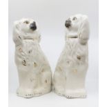 A pair of large Staffordshire flatback figures of spaniels (2)