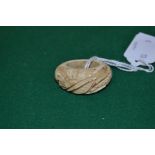 An antique carved ivory toggle