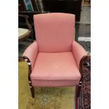 A modern chair with pink upholstery