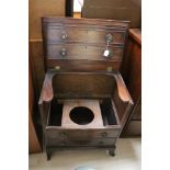 A Georgian commode in the form of a chest.