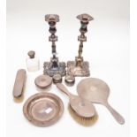 A silver collection to include; dressing table set, pair of candle sticks, napkin rings,