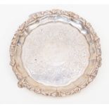 A Victorian silver salver, raised border with floral rim,