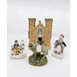 A collection of 19th Century Staffordshire figures including: façade of Church, An Indian figure,