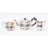 A George V silver three piece tea service, including teapot, sugar bowl and milk jug,