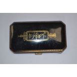 An early 20th Century white metal and black enamelled cigarette case,