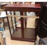 A large display cabinet with glass fronted panels