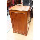 A Victorian mahogany single door side cabinet, the door enclosing two fitted shelves,