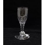 A late 18th Century slender wine glass, cut bowl and a facet cut stem,