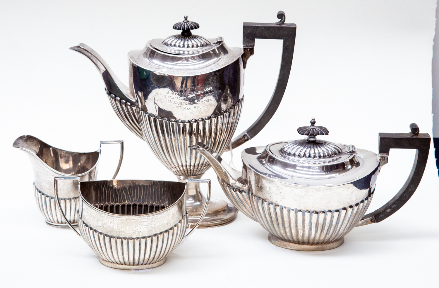 A George V silver tea & coffee service Georgian style with gadroon lower sections, ebonised handles,