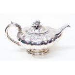 A George IV silver melon shape teapot, footed,