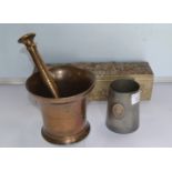 A Brass Mortar and Pessel 12cm in height,