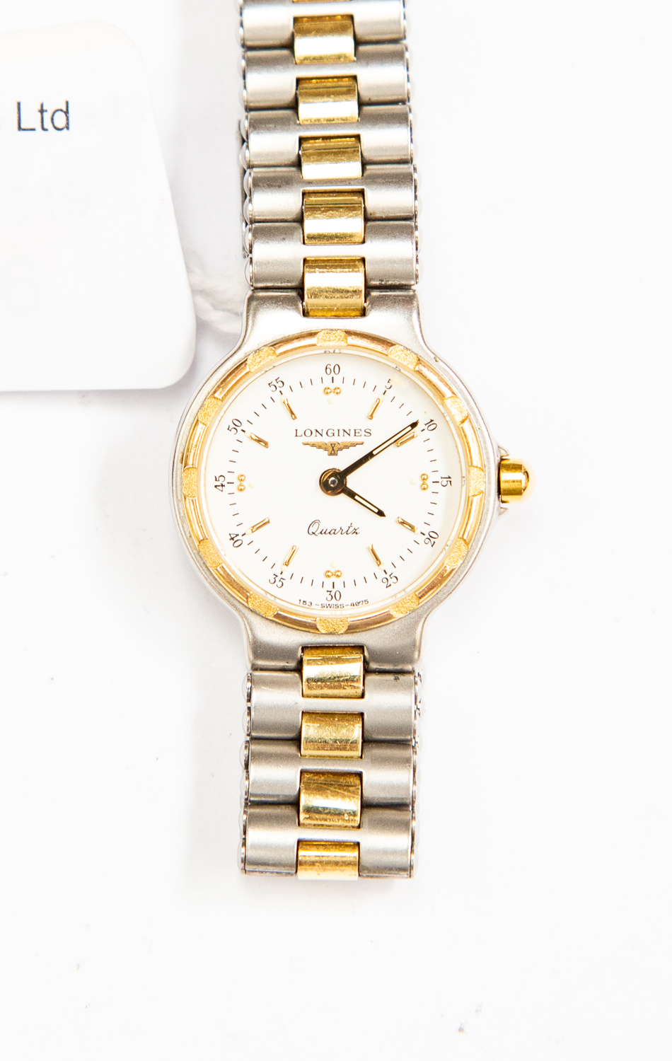 A ladies Longines stainless steel watch with quartz movement baton numerals on a white dial,