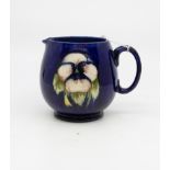 A Moorcroft pansy jug, blue WM monogram,