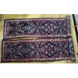 Two wool carpet runners, navy ground decorated with scrolling foliage, 1= 12ft x 2.