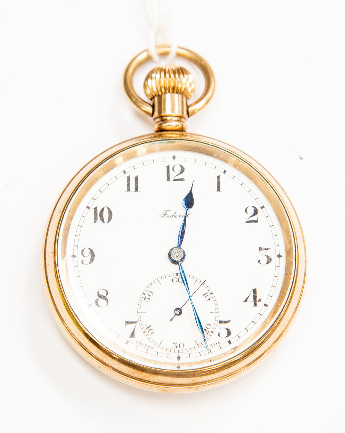 A Federal unmarked yellow metal open faced pocket watch, subsidiary dial, white enamel,