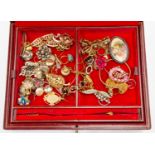 A jewellery box (maroon in colour) with key,