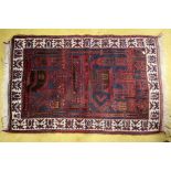 Hand knotted small rug, geometric design of blue and red hues. 82x 132cm approx.