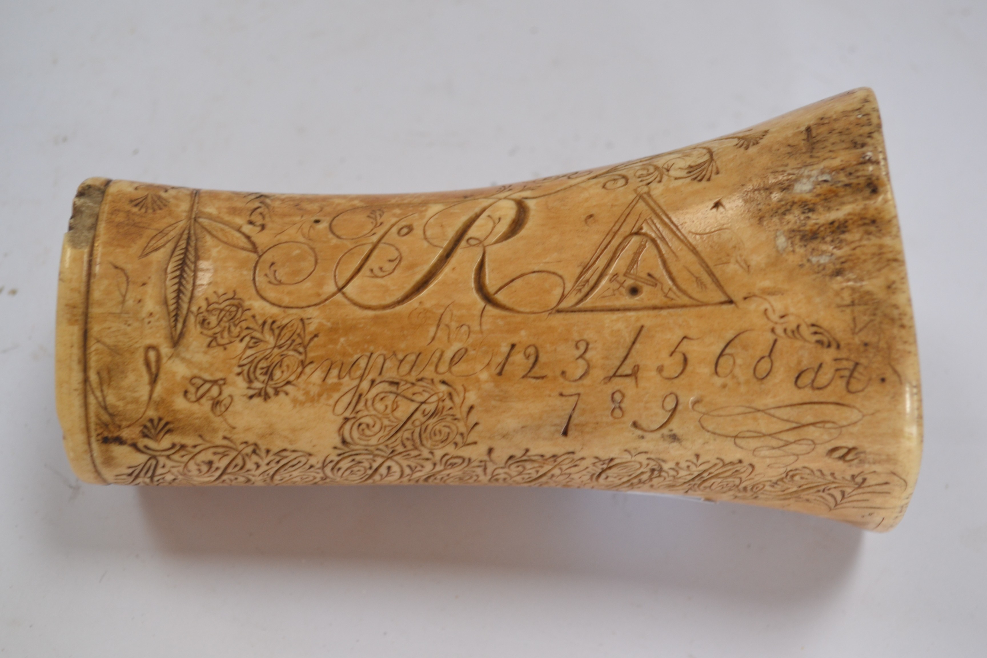 A George III carved bone libation cup of Masonic interest,