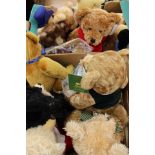 A collection of assorted teddy bears to include: Paddington Bear, Russ, Harrod's and others various.