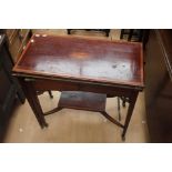 An Edwardian mahogany fold-over card table,