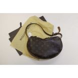 A Louis Vuitton Croissant Bag, monogrammed canvas, 10.5" length approx, shoulder strap, suede lined.