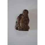 A treen netsuke in the form of Hotei,