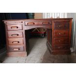An Early 20th Century Oak Pedestal Desk, three drawers on each pedestal.