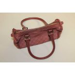 A Gucci Hobo handbag, with a dusky pink fabric with the double G logo,