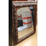 Late 19th Century Black Forest style over mantle oak mirror with oak leaf decoration