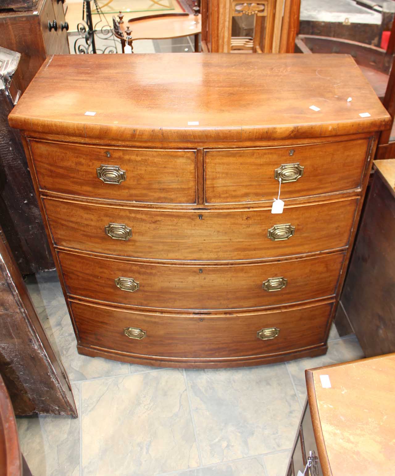 A George III bow fronted mahogany chest of drawers.