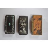 Three various 19th Century shaped rectangular snuff boxes, two ebonised with mother of pearl inlay,