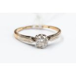A diamond solitaire 18ct gold ring, the round old cut diamond approx 0.
