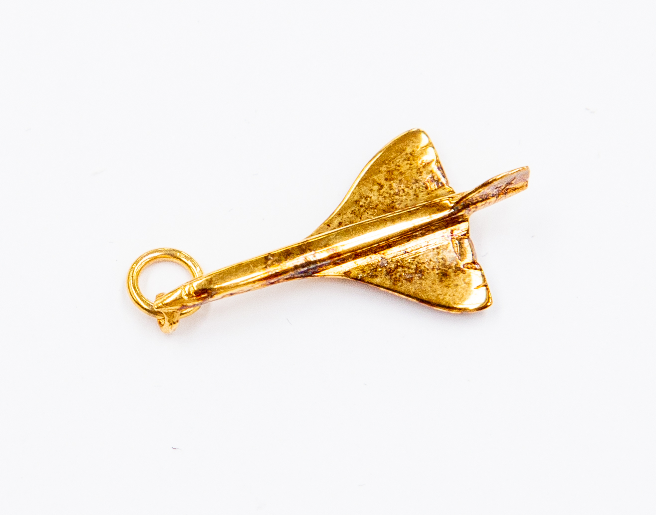 A 9ct gold concorde charm, weight approx 1.