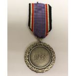 WW2 Third Reich Luftschutz Medal 1938. 1957 reissue without the Swastika.