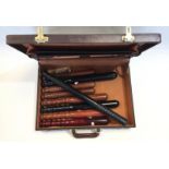 A collection of nine British Police Truncheons in a leather breifcase to include 10.