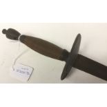 Sword with single edged 755mm long blade. Brass clamshell guards. Wooden grip. Overall length 92cm.
