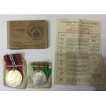 WW2 British War and Defence Medals in original box of issue complete with ribbons and slip named to