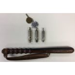 A collection of three British Police whistles: Metropolitain Police serial number 082884 by Hudson