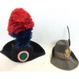 A collection of Italian Police caps to include Carabineri Tricorn hat with feathered plume,