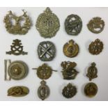 WW2 British cap badges, collar dogs, shoulder titles, rank pips, etc to include plastic REME.