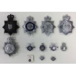 A collection of Derbyshire Police Force Queens crown cap badges including Derby County