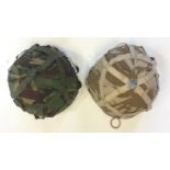 British Mk 6 GS helmet with chinstraps and DPM camo cover and another with Desert camo cover dated