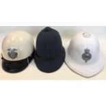 A collection of World Police Officers cap, helmets and Shako's to include: French CRS Roit helmet,